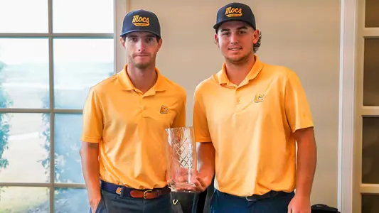 Braedon Wear (l) & Ethan Whitaker (r) posed with the trophy for their co-win at the Bentwater Intercollegiate