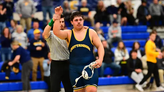 Ethan Vergara gets his hand raised after his match-clinching win over Gardner-Webb