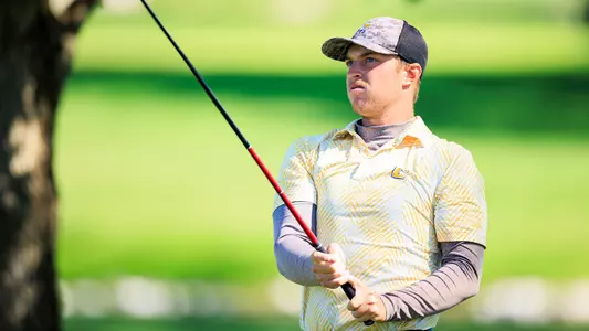 Garrett Engle holds his club in front of him as he stares down a shot at Kentucky