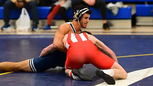 Noah Castillo expertly fends off an Indiana shot in a major decision win.