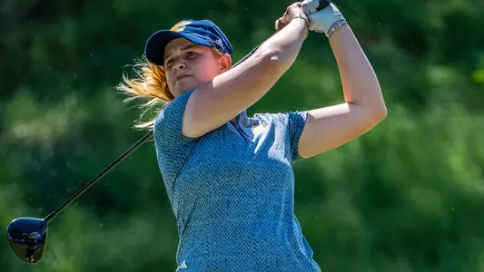 Kera Healey completes her drive staring intently following it down the center of the fairway at Vandy
