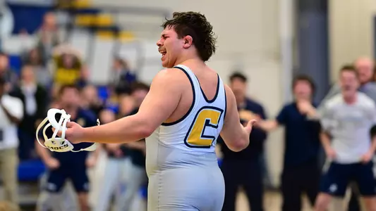 Ethan Vergara celebrates match-clinching victory with his arms spread in "are you not entertained" fashion