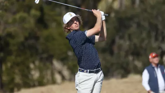 Camden Braidech holds his pose watching his short iron approach at Briar's Creek