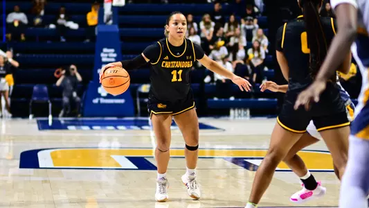 Caia Elisaldez directs the offense from the top of the key against UNCG
