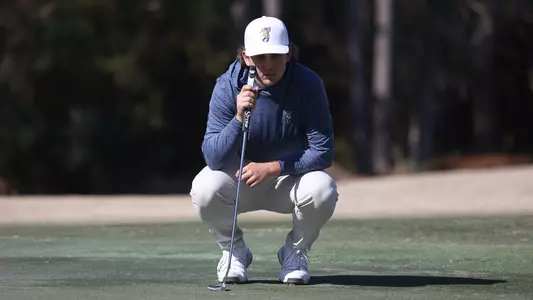 Ethan Whitaker intently reads the green at Briar's Creek