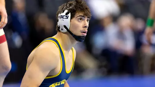 Sergio Desiante looks at the scoreboard with a satisfied glance after his NCAA win over Oklahoma