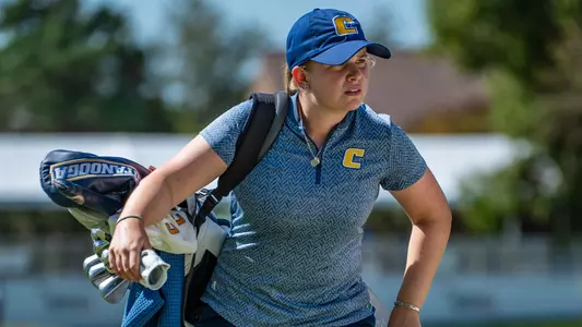 Kera Healey carries her bag toward the green eyeing a birdie putt at Vandy