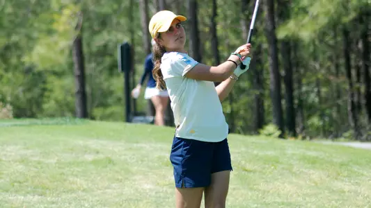 Violeta Fernandez-Tagle follows her iron shot into the green at the SoCon Championships