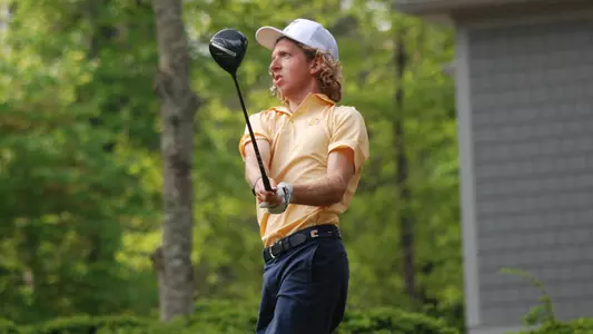 Camden Braidech holds his pose watching his drive at the SoCon Championships.