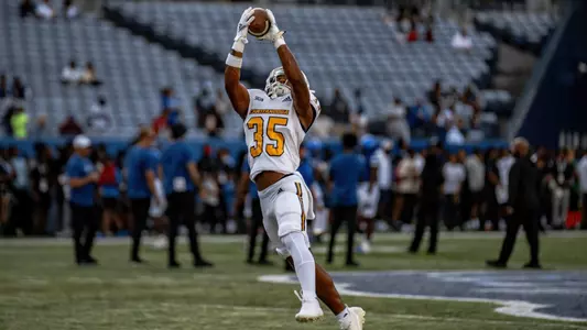 Martez Cooksey, Jr., extends for interception in warm ups prior to matchup at Georgia State.