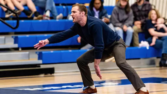 Coach Kyle Ruschell calls for three takedown points during the dual win over Bellarmine