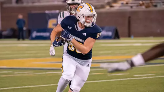 John McIntyre looks upfield running after a catch against Portland State.