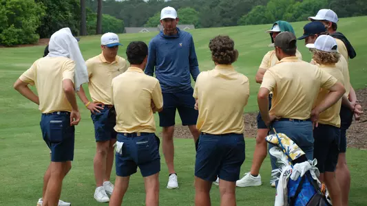 Team surrounds Coach Blaine Woodruff for a talk after the SoCon Championhips