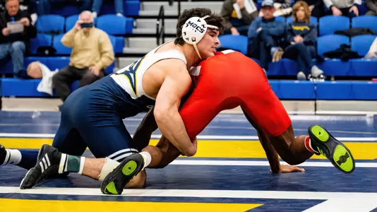 Kamdyn Munro looks to lock in a cradle early in his bout against Indiana