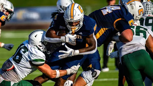 Ryan Ingram drags Stetson tacklers for extra yards in the Mocs home win over the Hatters