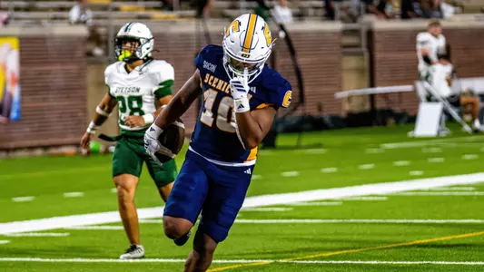Journey Wyche celebrates after his 78 yard TD run in the win over Stetson