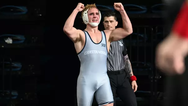 Landon Jones pumps his fist triumphantly after reaching the podium at the Southern Scuffle
