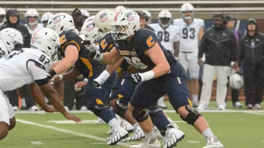 Offensive lineman Watts Alexander looks to engage the Samford defense post-snap