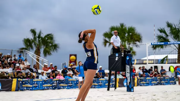 Corina Vale serving the ball in the NCAA Tournament First Round against Stanford