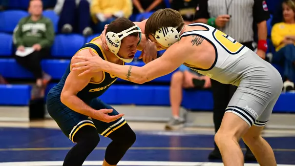 Cody Chittum and Hunter Mason are locked up during third period of Blue-Gold match.