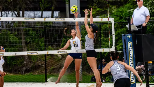 Ansley Gulledge tipping the ball over the net against Lindenwood