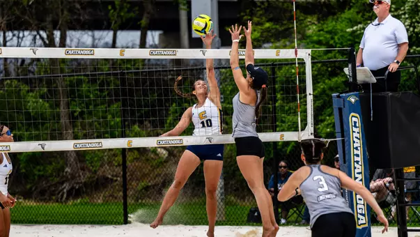 Ansley Gulledge tipping the ball over the net against Lindenwood