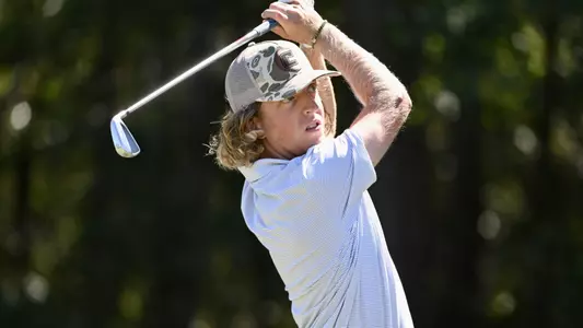Camden Braidech holds a high finish on an iron approach to the green.