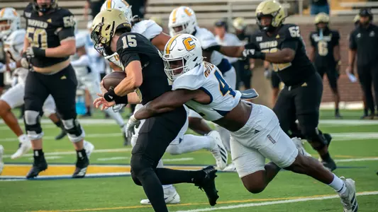 Zion Rutledge sacks the Wofford quarterback with a diving tackle from behind