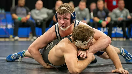 Kade Rule takes a glance at his coaches as he continues his onslaught in his SoCon Championship victory over App State