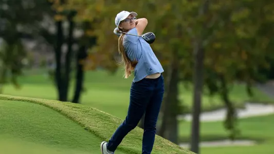 Rugile Pauliukonyte holds her finish as she stares down her drive flying safely into the fairway.