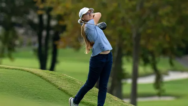Rugile Pauliukonyte holds her finish as she stares down her drive flying safely into the fairway.
