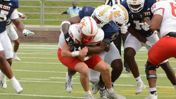 Montrell Henderson applies a bone-crunching hit to the VMI quarterback on a run
