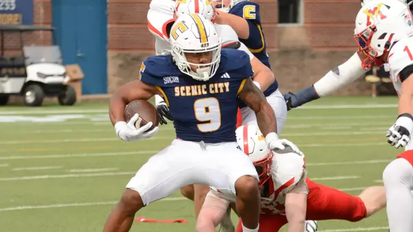 Kevin Lalin stops and shifts back to his left running for positive yardage against VMI