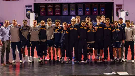 Group photo of the 2025-26 SoCon Wrestling Regular Season Co-Champs on the mat after the win at Bellarmine.