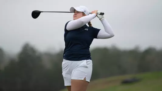 Kera Healey poses post drive watching her ball flight
