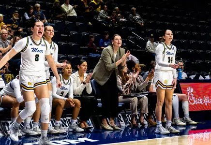 Coach Mallory Odell on bench