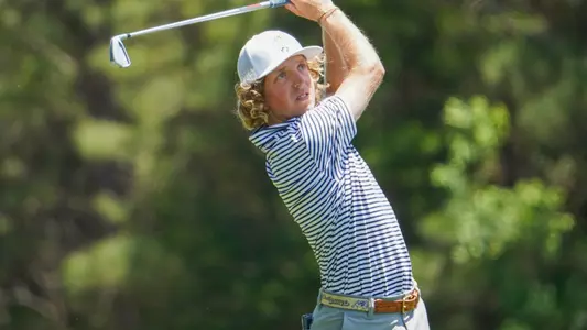 Camden Braidech tracks his shot with a high finish