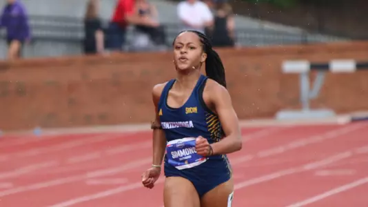 A sprinter is running a race on a track.