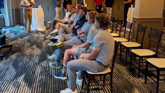 The men's golf team eagerly awaits the announcement of their NCAA Regionals site during a watch party at Chattanooga Golf & Country Club