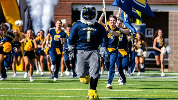 Scrappy leads the Mocs onto the field at Finley Stadium prior to the 2025 win over Furman