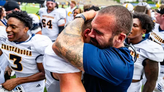 Gerry Pacitti with a Mocs Football player after a win