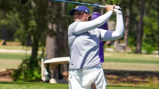 Bella Bugg holds her finish with a fairway metal at the Southern Conference Championships