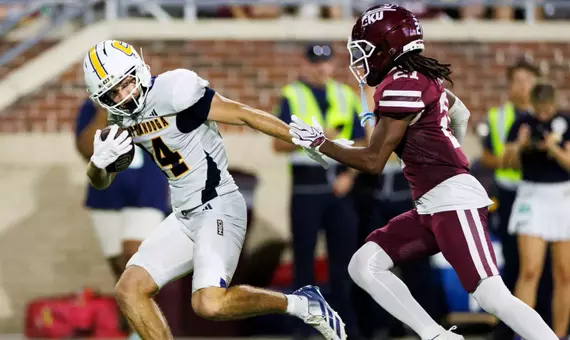 Ashton Schumann breaks a tackle