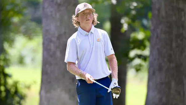 Camden Braidech holds his driver waist high pointing toward his target in the fairway as part of his pre-shot routine.