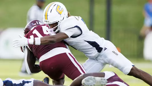 Keyshawn Jackson lays a crunching tackle on an Eastern Kentucky receiver near the sideline.