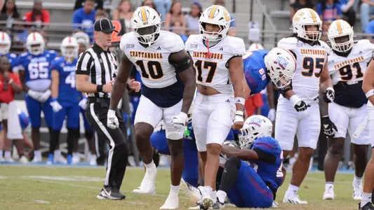 Orlando Daniels stands and celebrates with flexing arms a big tackle for loss at West Georgia