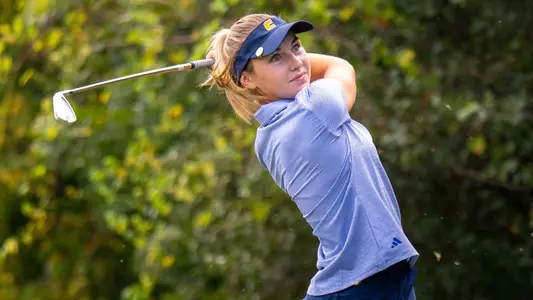 Claire Roberts admires her ball flight on a par 3 at the Player Development Complex.
