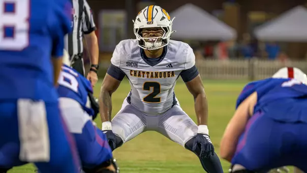 Kristian Ozane surveys the offense in a crouched stance pre-snap at West Georgia