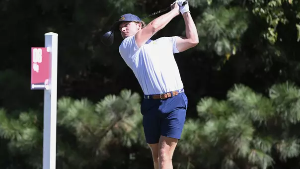 Ward Harris completes his swing arc following his drive down the fairway