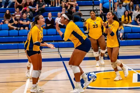Bailey Burgess and Mallory Merz celebrate a point